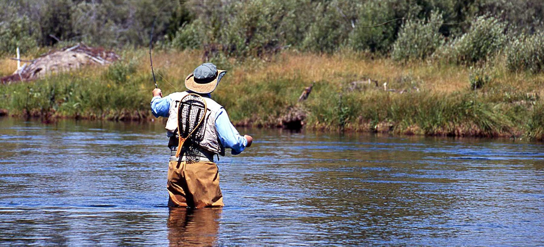 Fly fishing the Madison River in Montana - USA Travel Guide.