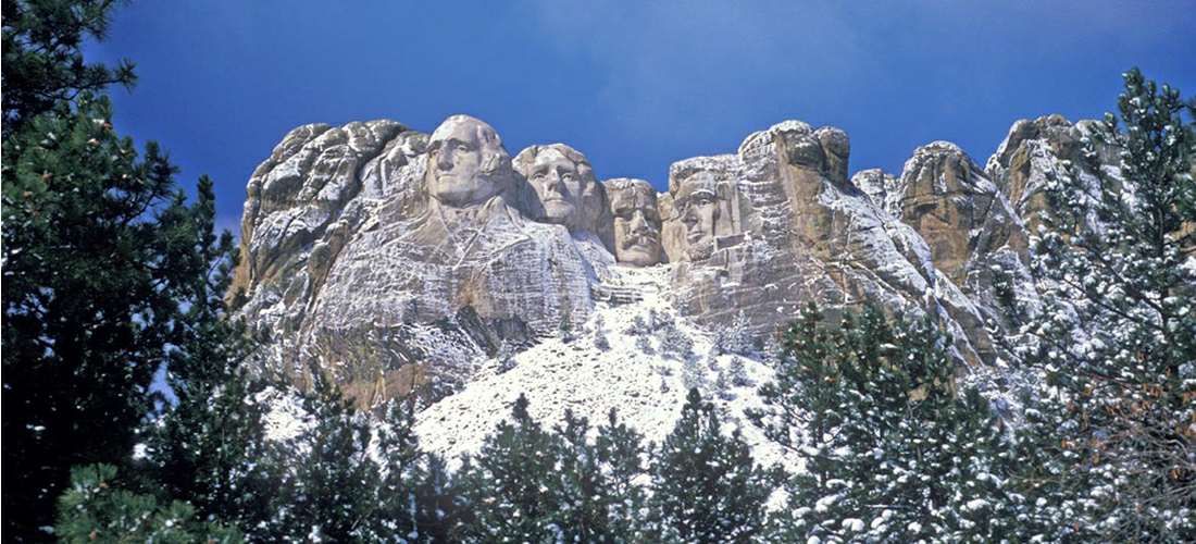 The Mount Rushmore National Memorial is a sculpture carved into the granite face of Mount Rushmore near Keystone, South Dakota, in the United States.  See America!