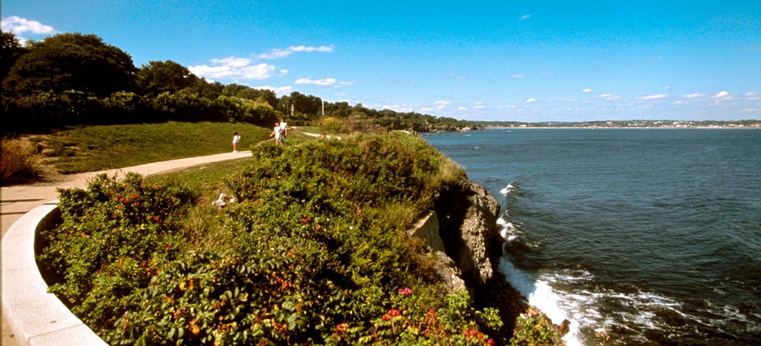 The Newport Cliff Walk is considered one of the top attractions in Newport, Rhode Island, in the United States. It is a 3.5-mile (5.6 km) public access walkway that borders the shore line. It has been designated a National Recreation Trail.  See America