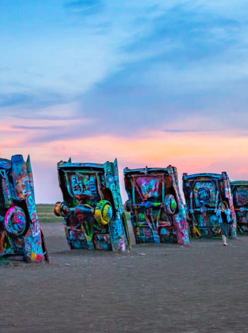 Sunset view of the colorful, half-buried cars at Cadillac Ranch in Amarillo, Texas