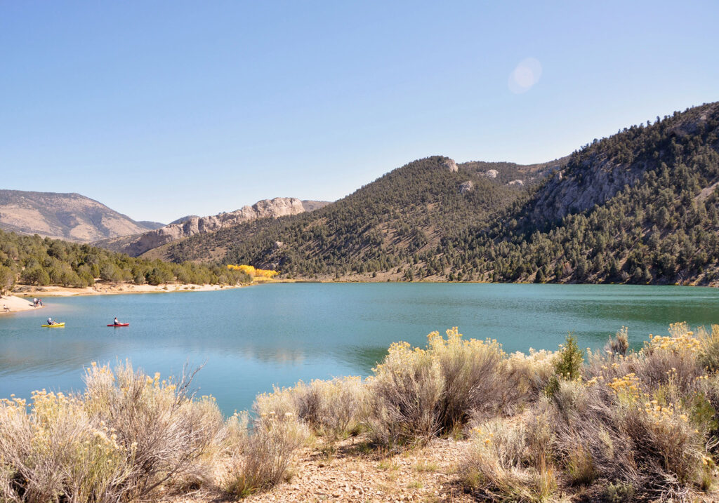 Kayaking surrounded by rolling hills and desert at Cave Lake State Park