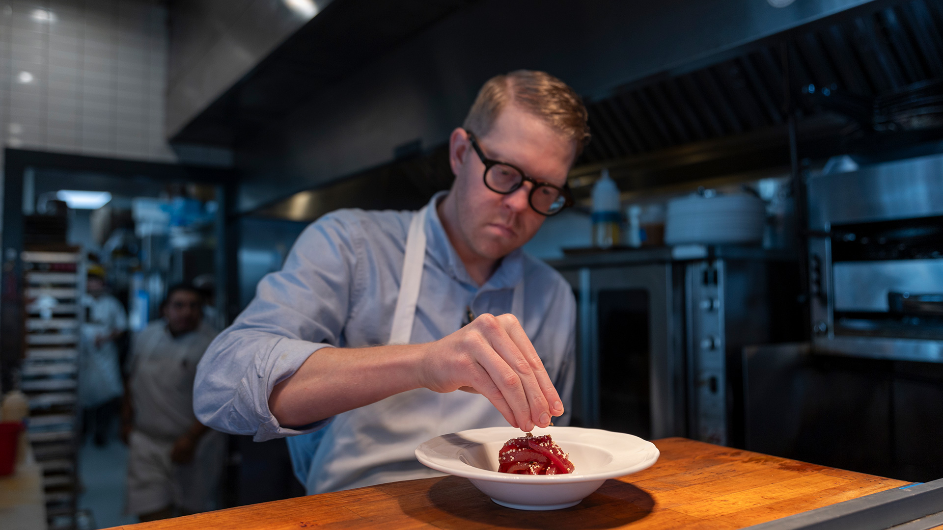 A chef plating food at Elvie's in Jackson, Mississippi