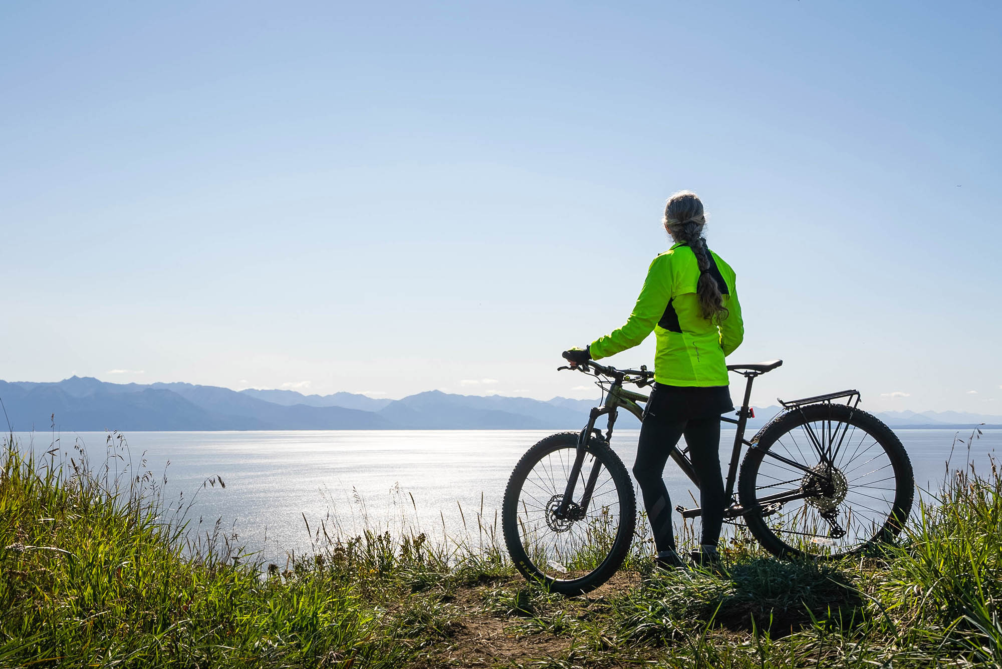 Biking the Kincaid Bluff Trail near Anchorage, Alaska; Credit: JodyO.Photos