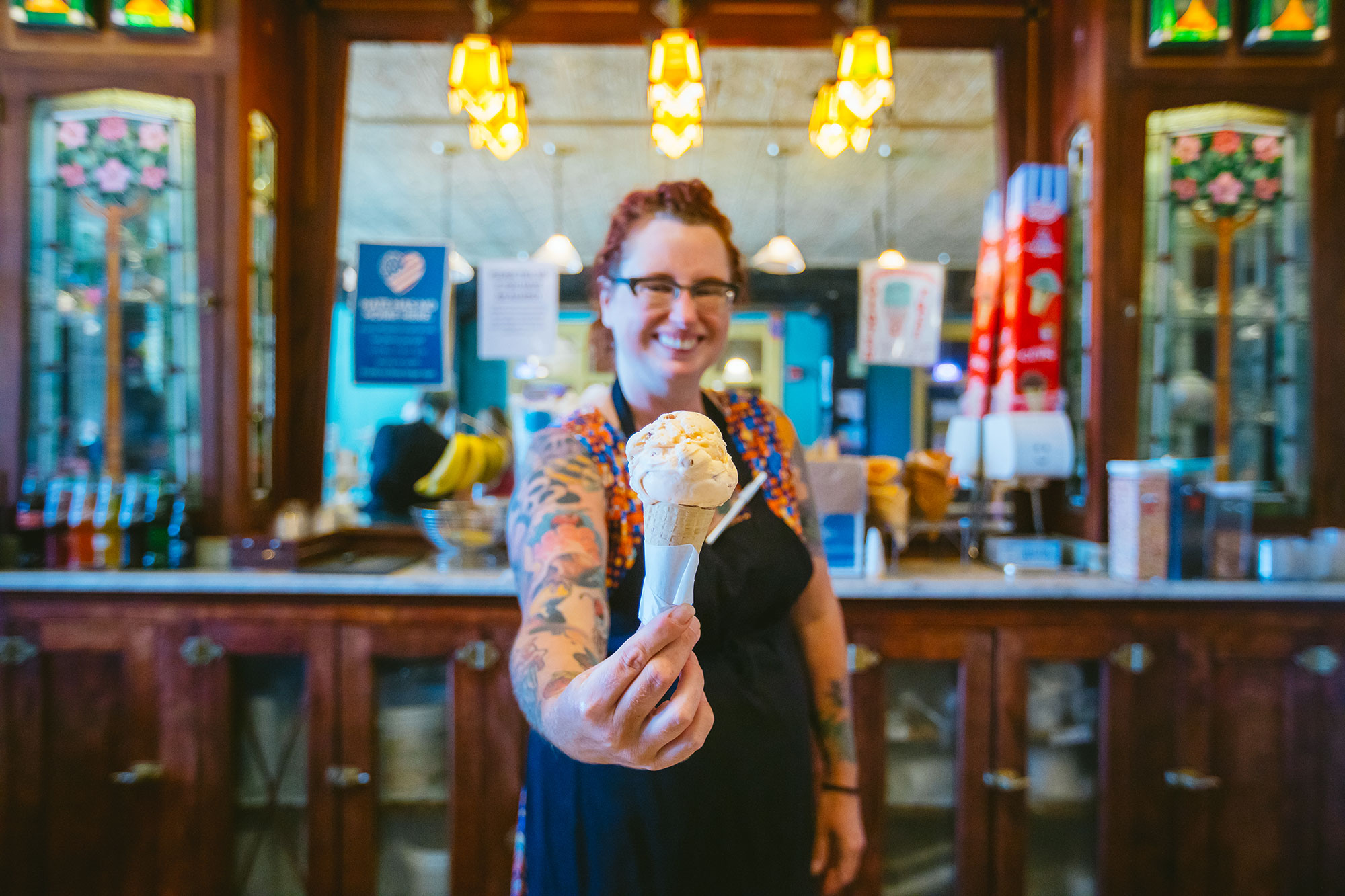 Worker with ice cream at the iconic Ivanna Cone ice cream shop in Lincoln, Nebraska