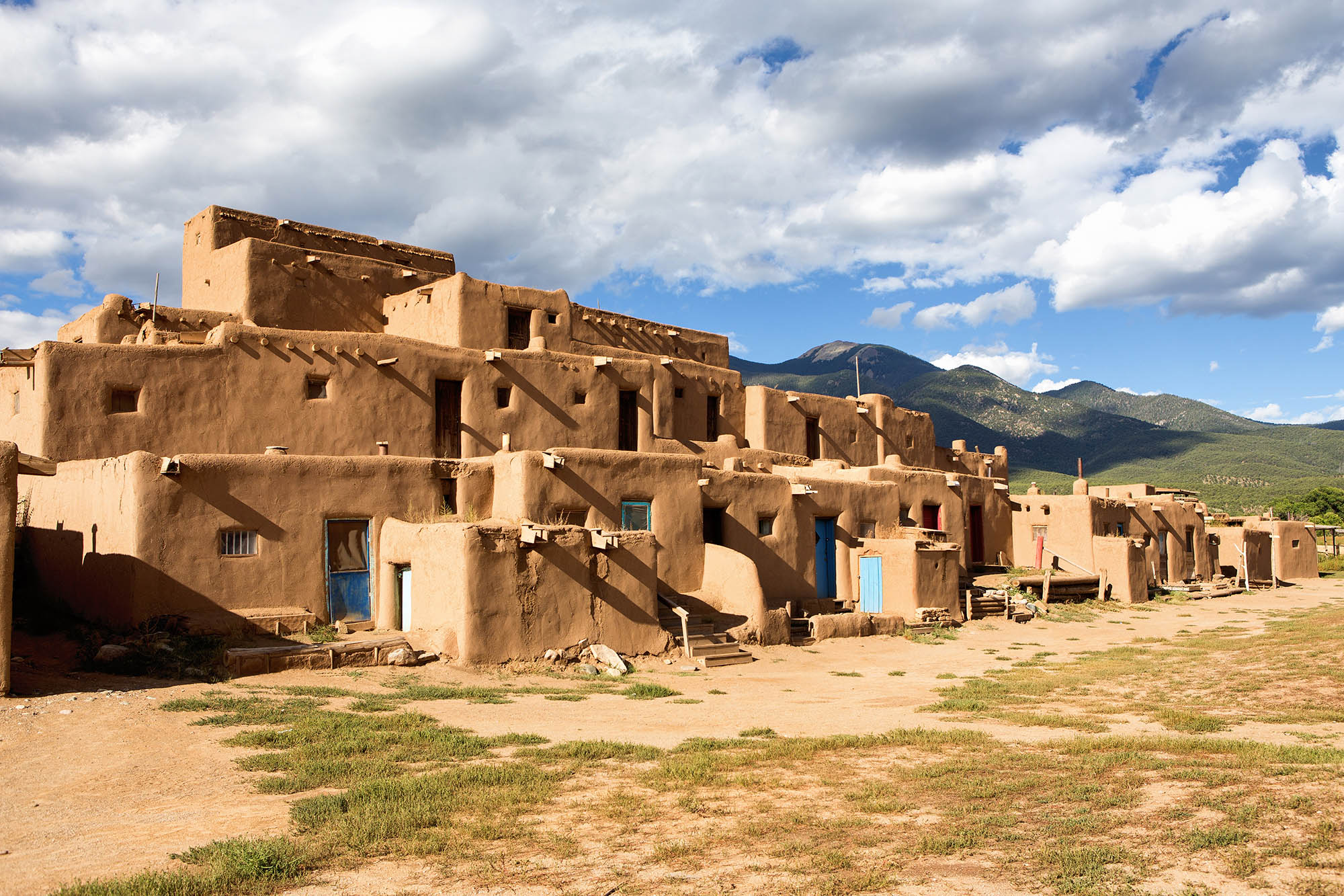 Exterior view of the multistory adobe buildings at Taos Pueblo in Taos, New Mexico
