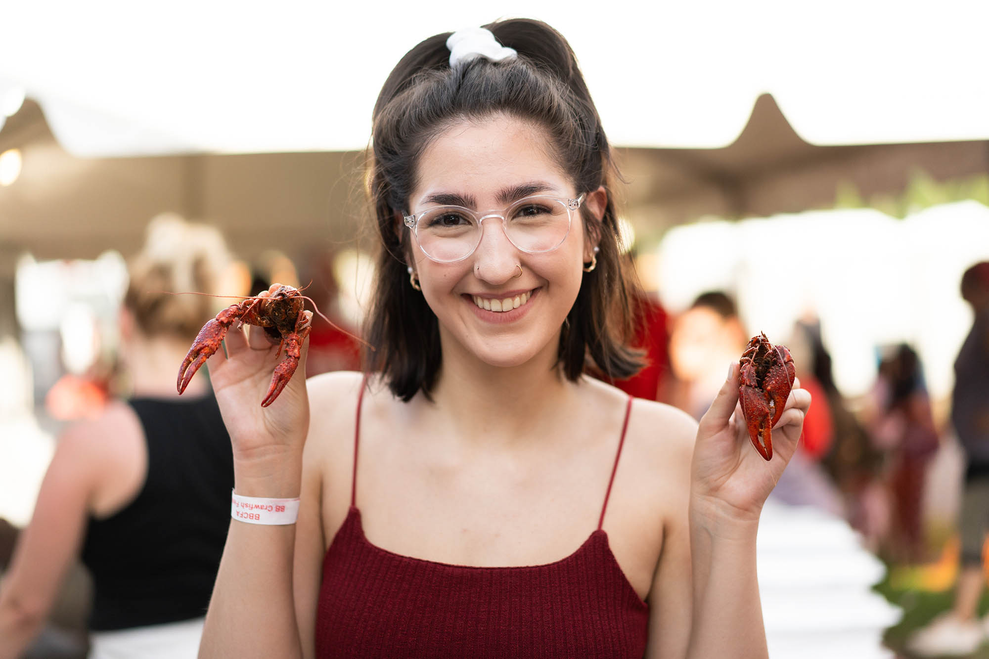 Posing with crawfish at the Breaux Bridge Crawfish Festival near Lafayette, Louisiana. Credit: Denny Culbert 