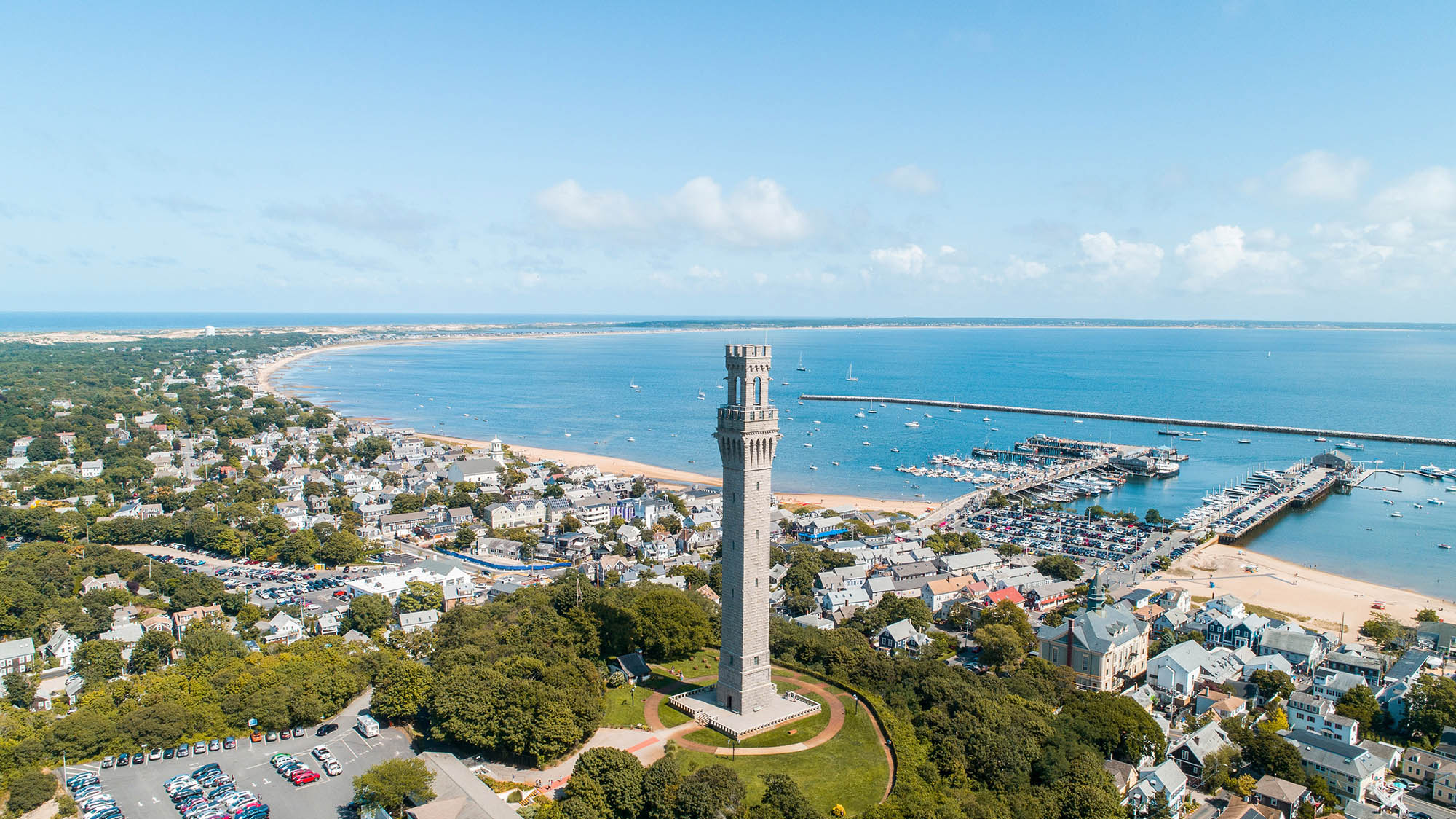 The Pilgrim Monument towers above the coastline of Cape Cod, Massachusetts; Credit: Hawk Visuals