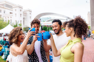 Group of friends toasting drinks in Baton Rouge, Louisiana. Credit: Jordan Hefler