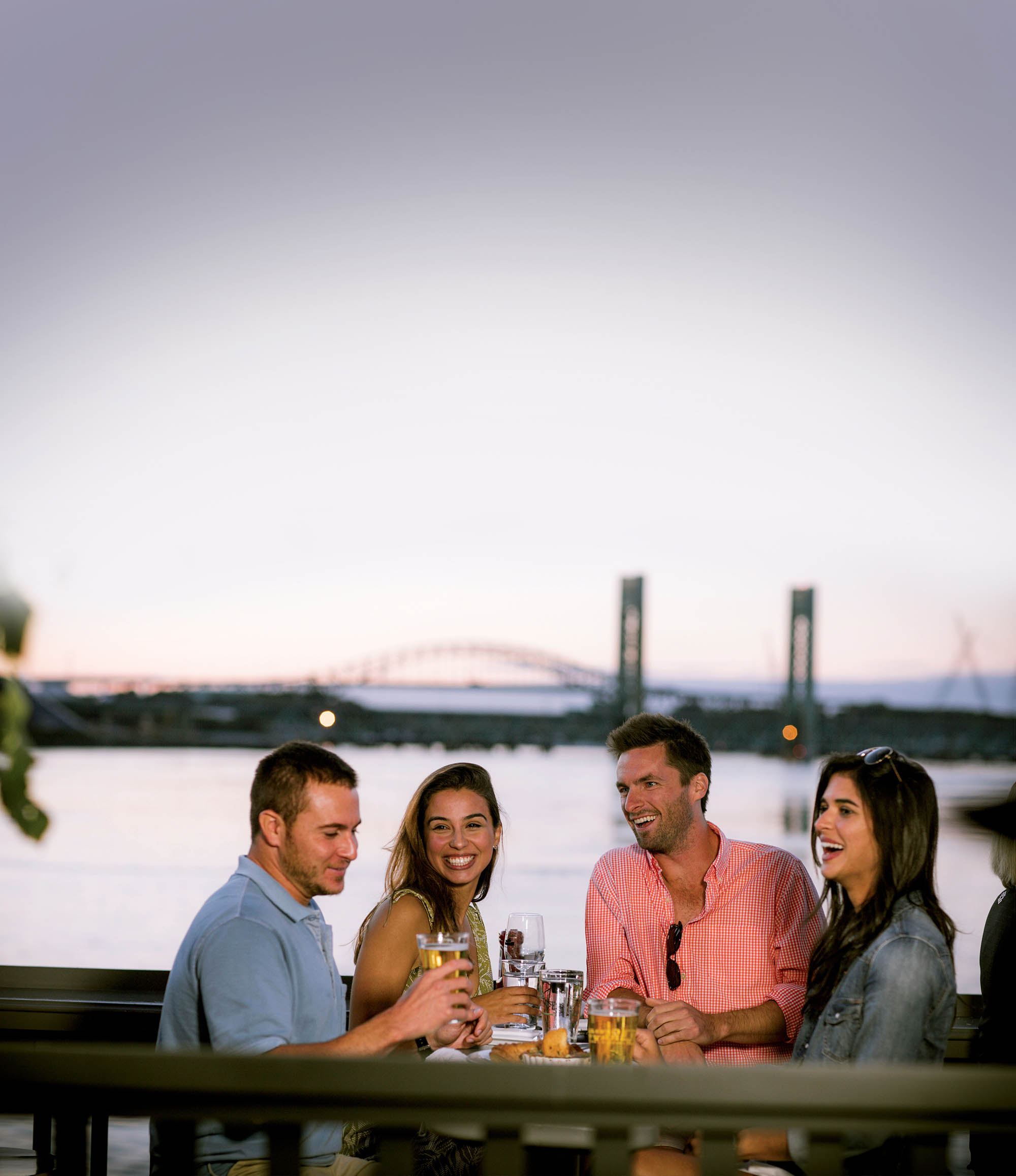 A group enjoys waterfront patio dining in Portsmouth, New Hampshire