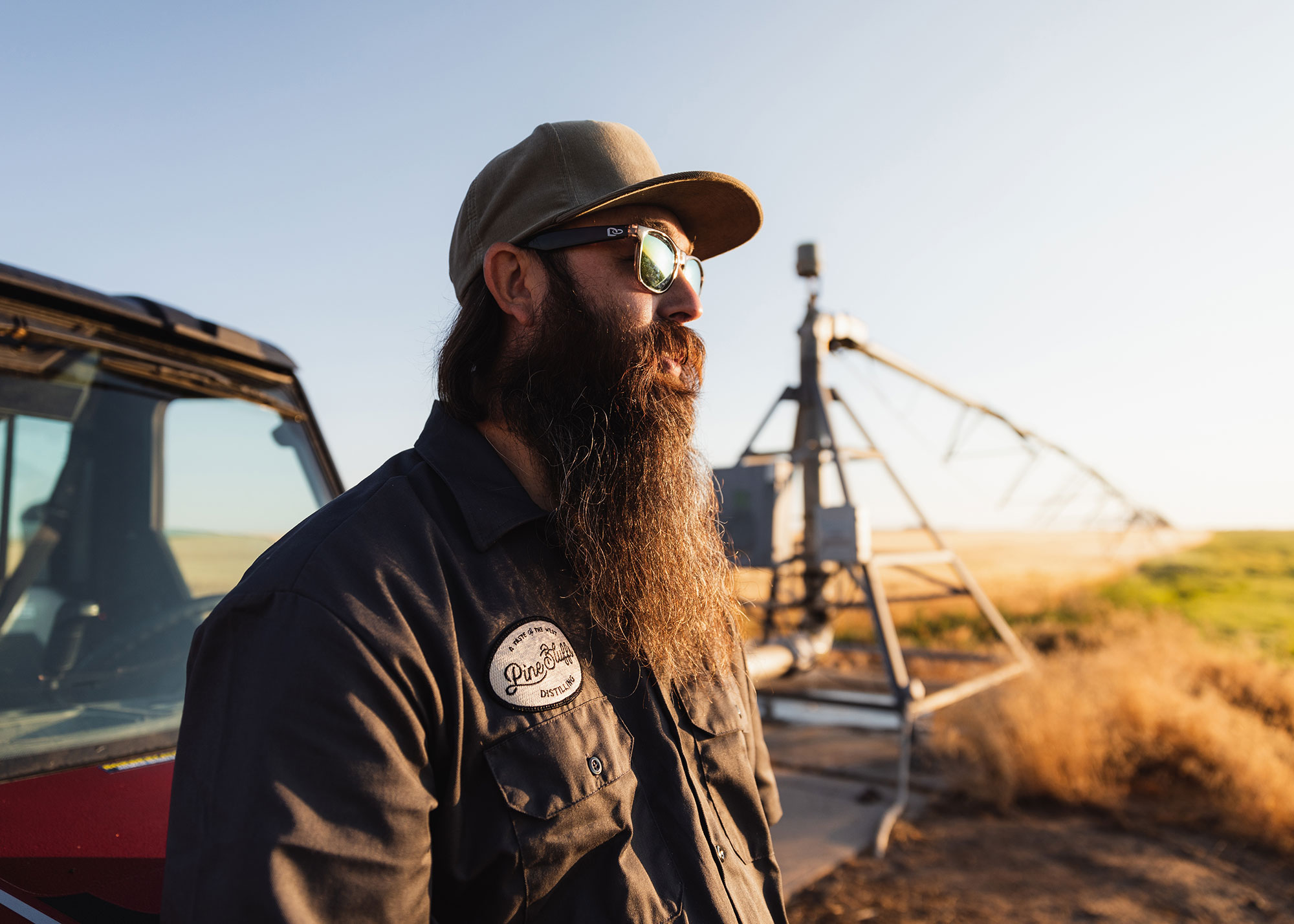 Worker outside Pine Bluffs Distilling, a distillery in Pine Bluffs, Wyoming; Credit: Warehouse 21
