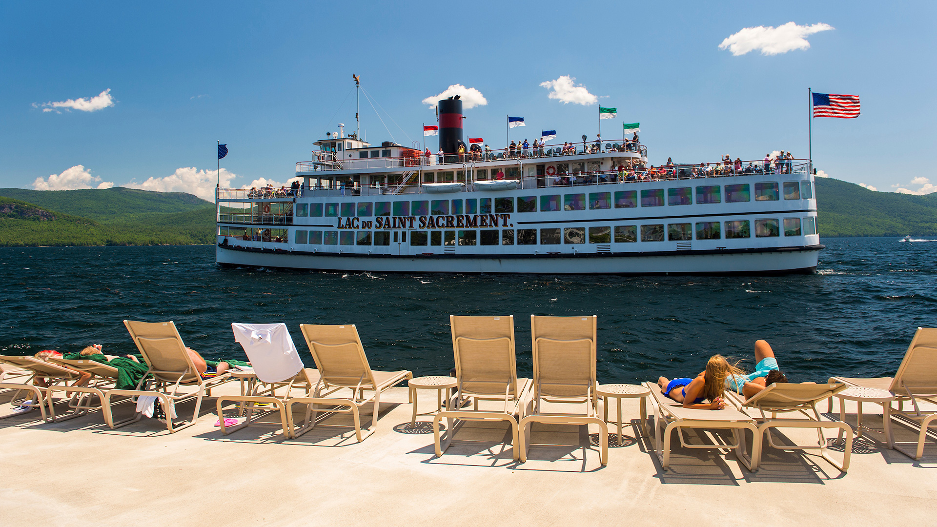 A tour boat passes the Sagamore Resort on Lake George in New York
