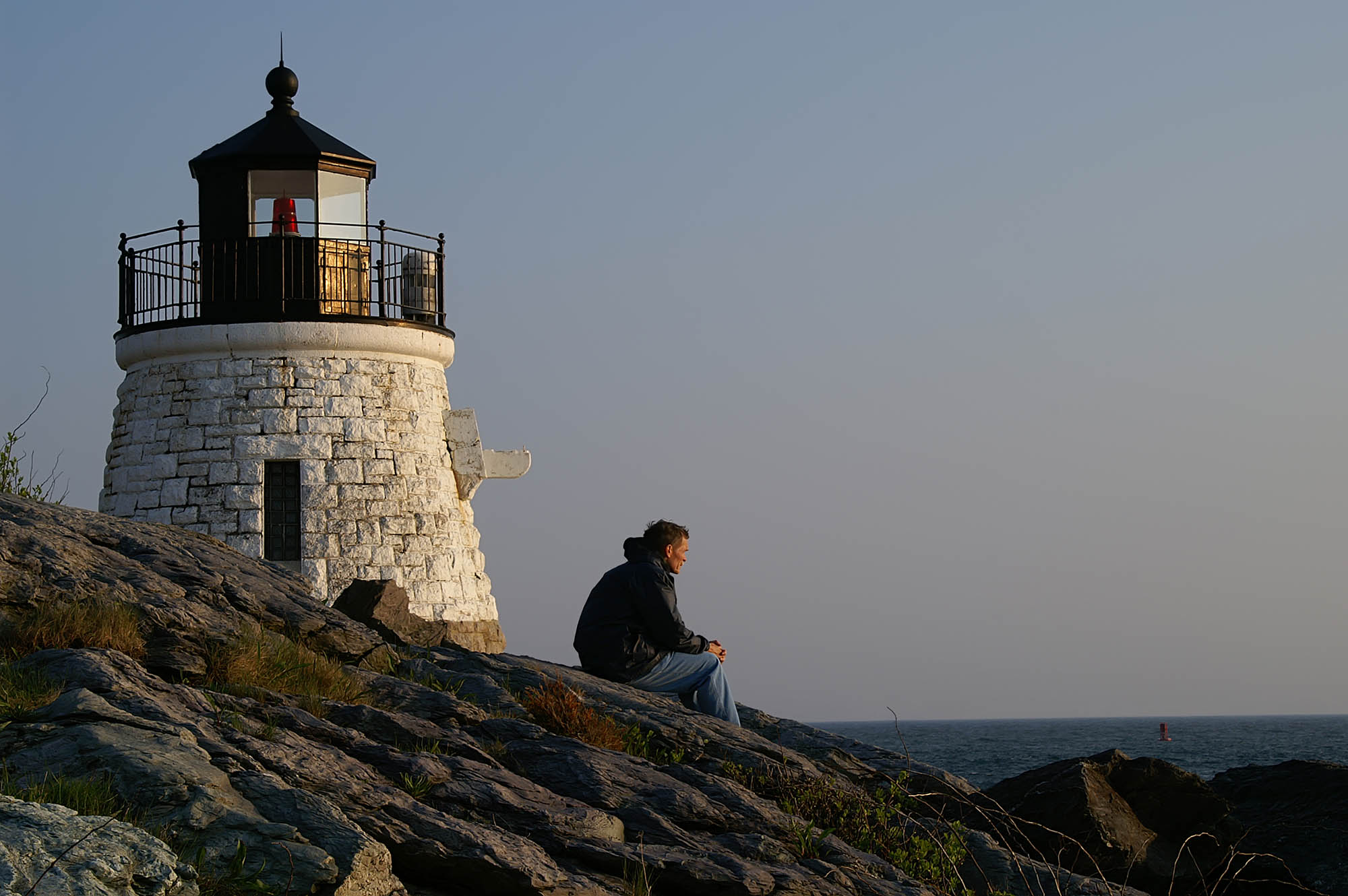 Sitting on the rocky shores of the Castle Hill Lighthouse in Newport, Rhode Island