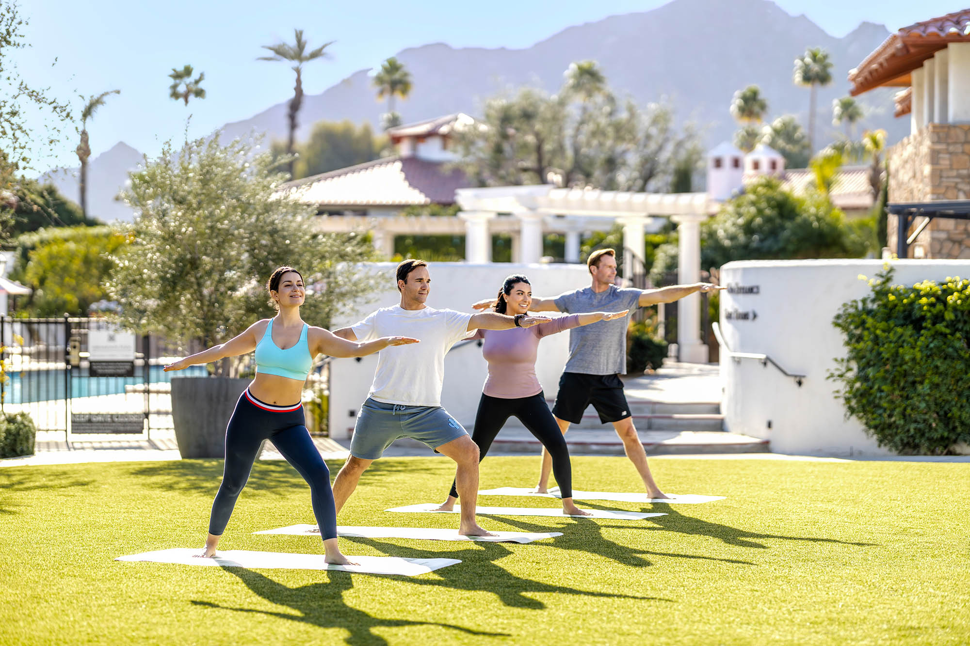 Doing yoga on the lawn in Palm Springs, California