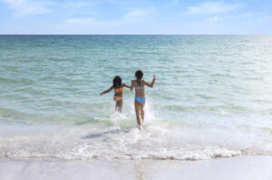 Splashing in the blue-green waters of Clearwater Beach, Florida; Credit: Visit St. Pete Clearwater