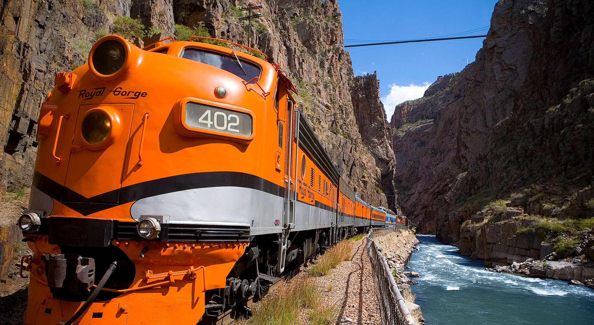 Train of the Royal Gorge Route Railroad traveling along the Arkansas River near Colorado Springs, Colorado