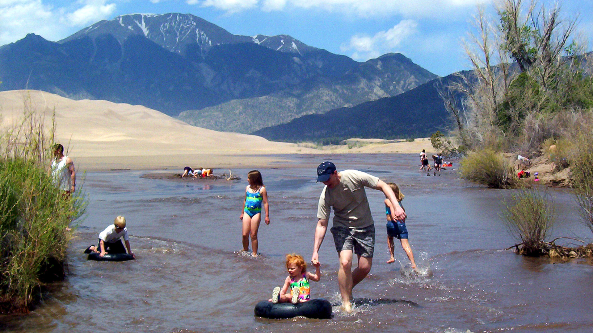 Floating down Medano Creek, a tributary of the Rio Grande in Alamosa, Colorado