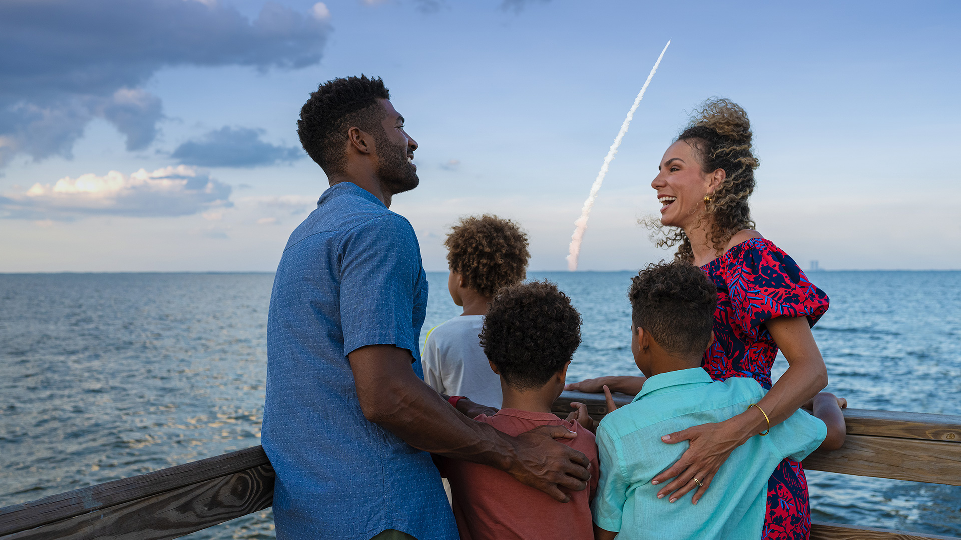 View of a rocket launch from a pier on Florida’s Space Coast