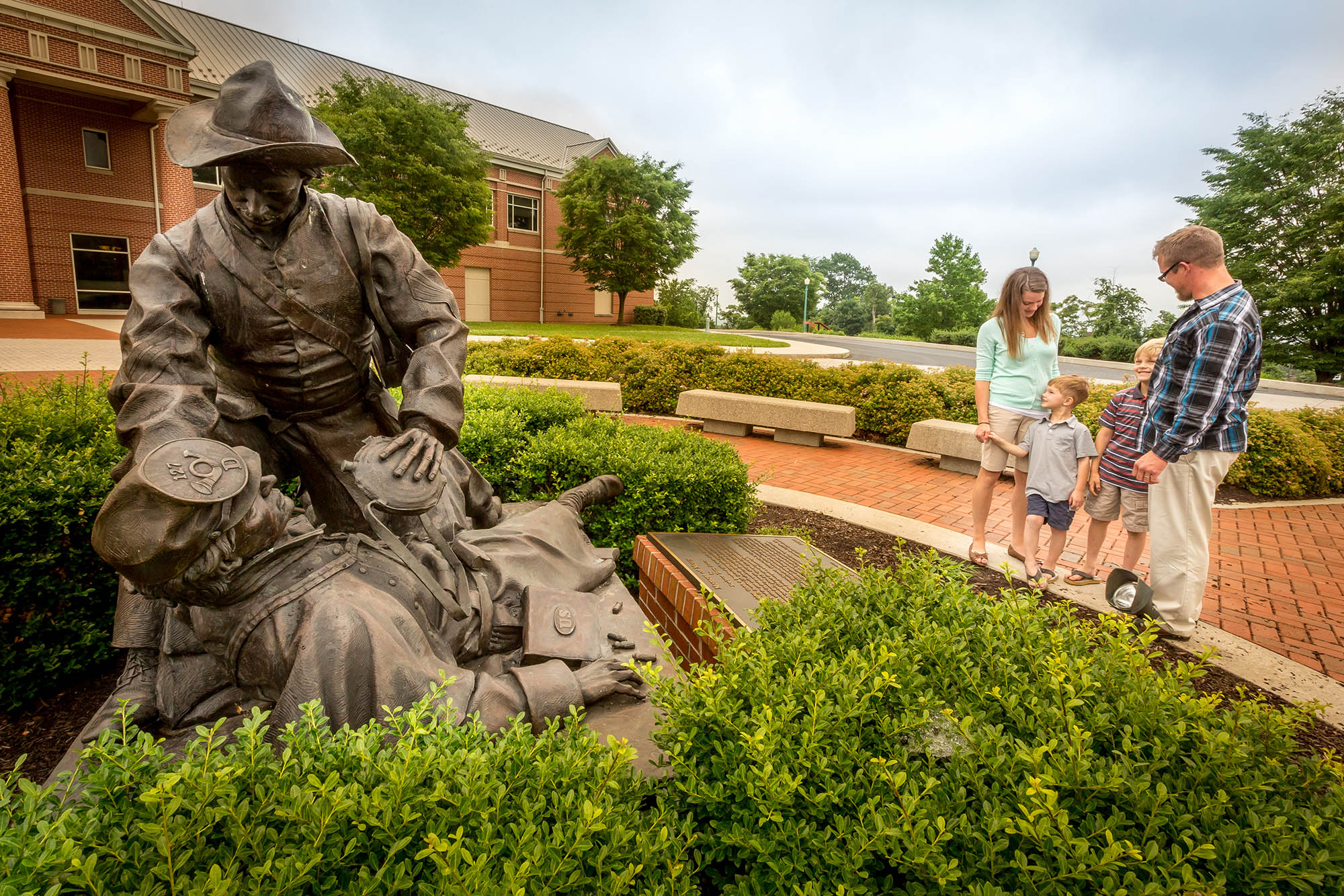 A family viewing the "Moment of Mercy" sculpture at the National Civil War Museum in Harrisburg, Pennsylvania. Credit: Jason Brown
