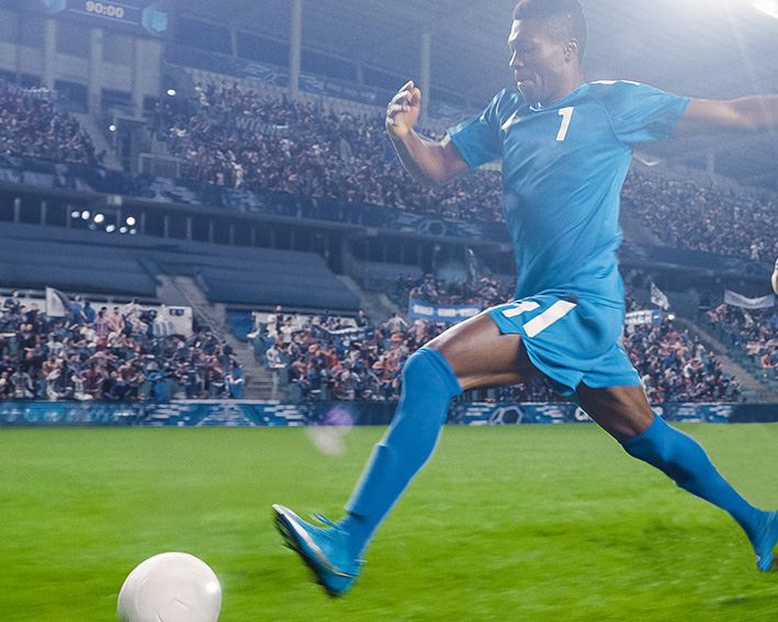 soccer player kicking ball