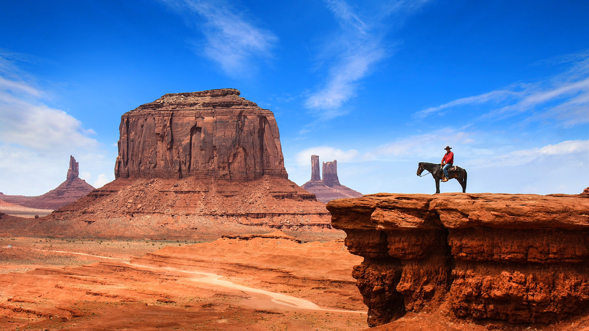Horseback rider overlooking Monument Valley