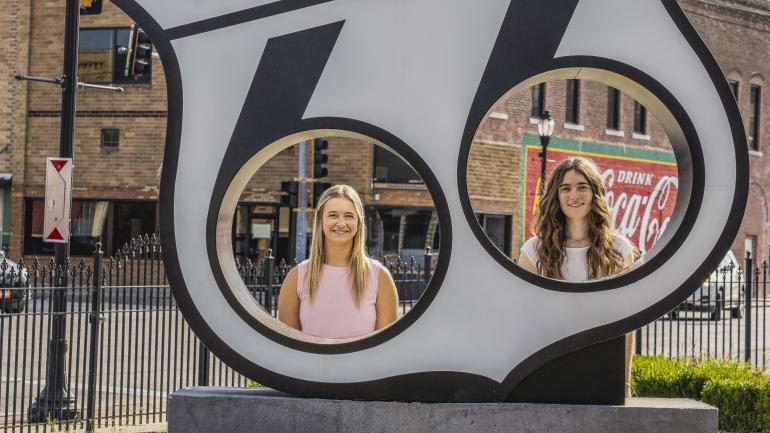 Posing for photos with Route 66-inspired art in Galena
