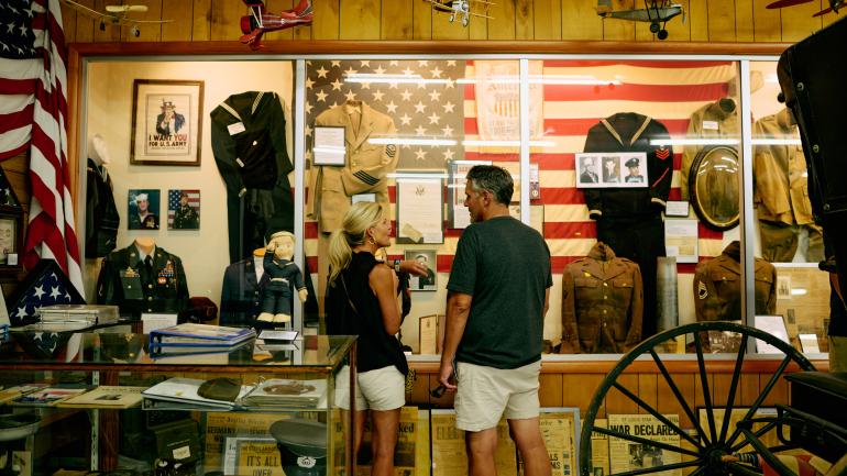 Viewing military history displays at the Baxter Springs Heritage Center & Museum
