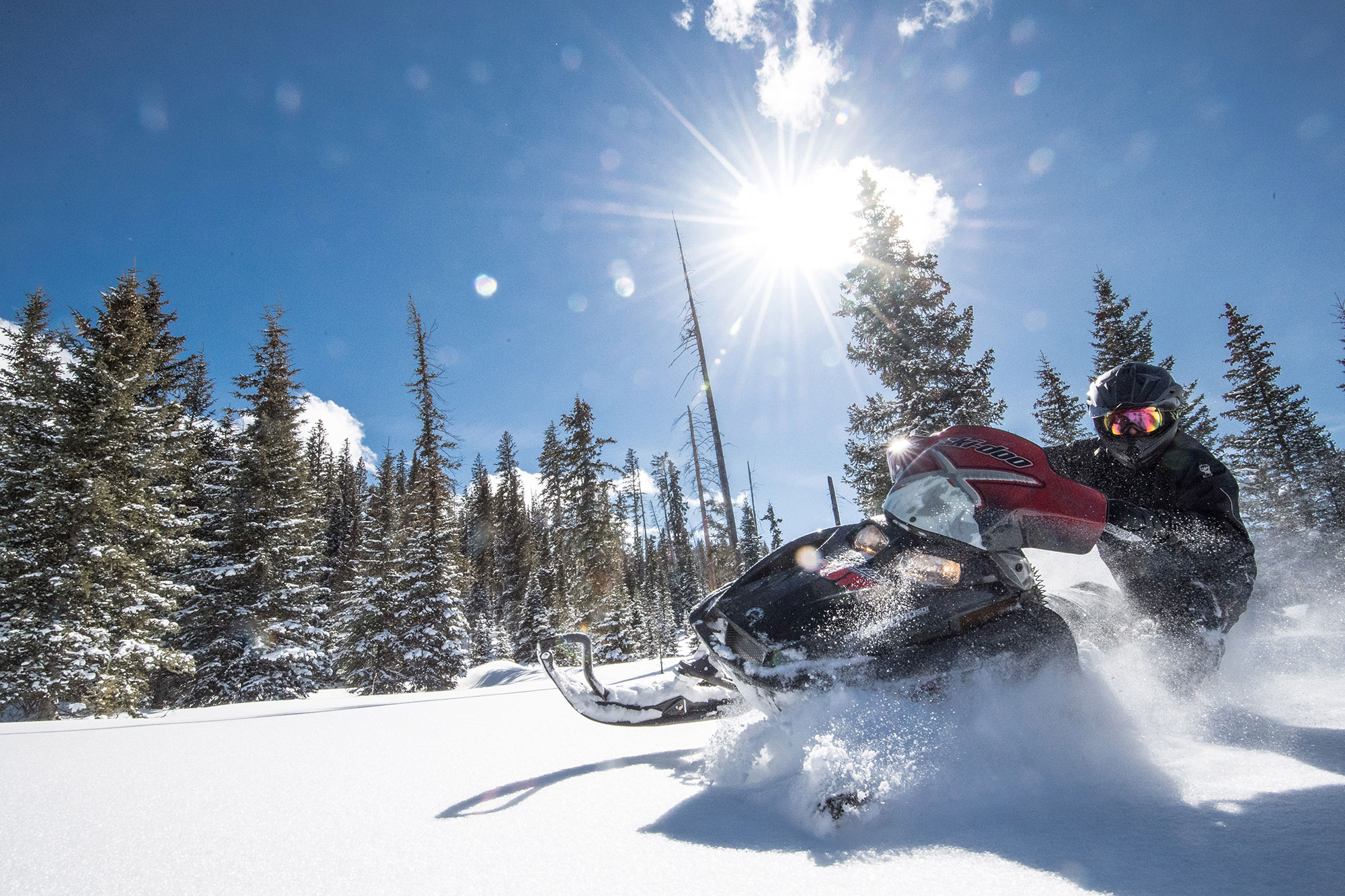 Visitor on a snowmobile tour of Sunlight Mountain Resort in Glenwood Springs, Colorado