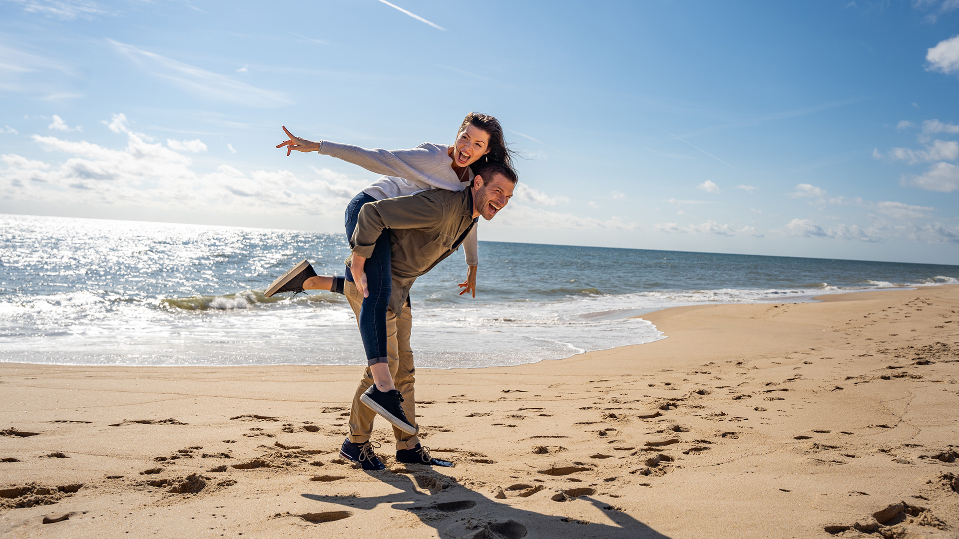 A couple on a beach on the South Shore of Long Island, New York