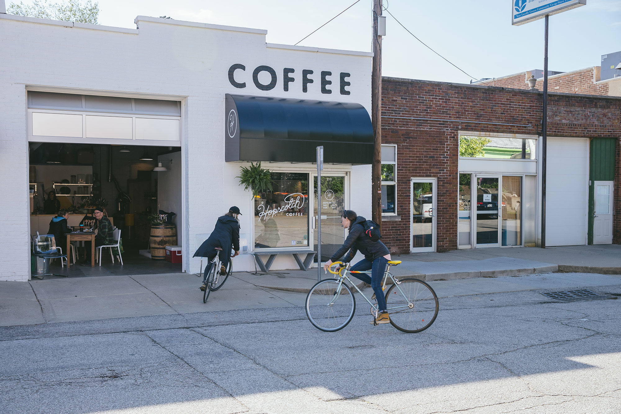 Bicyclists outside Hopscotch Coffee in Bloomington, Indiana