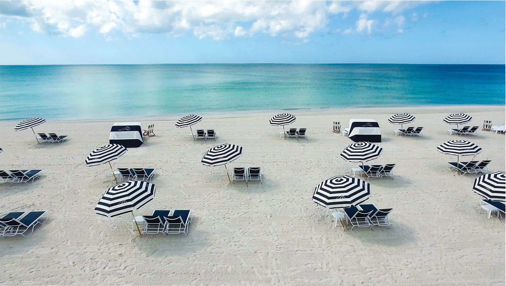 Open umbrellas on Longboat Key Club beach near Sarasota, Florida
