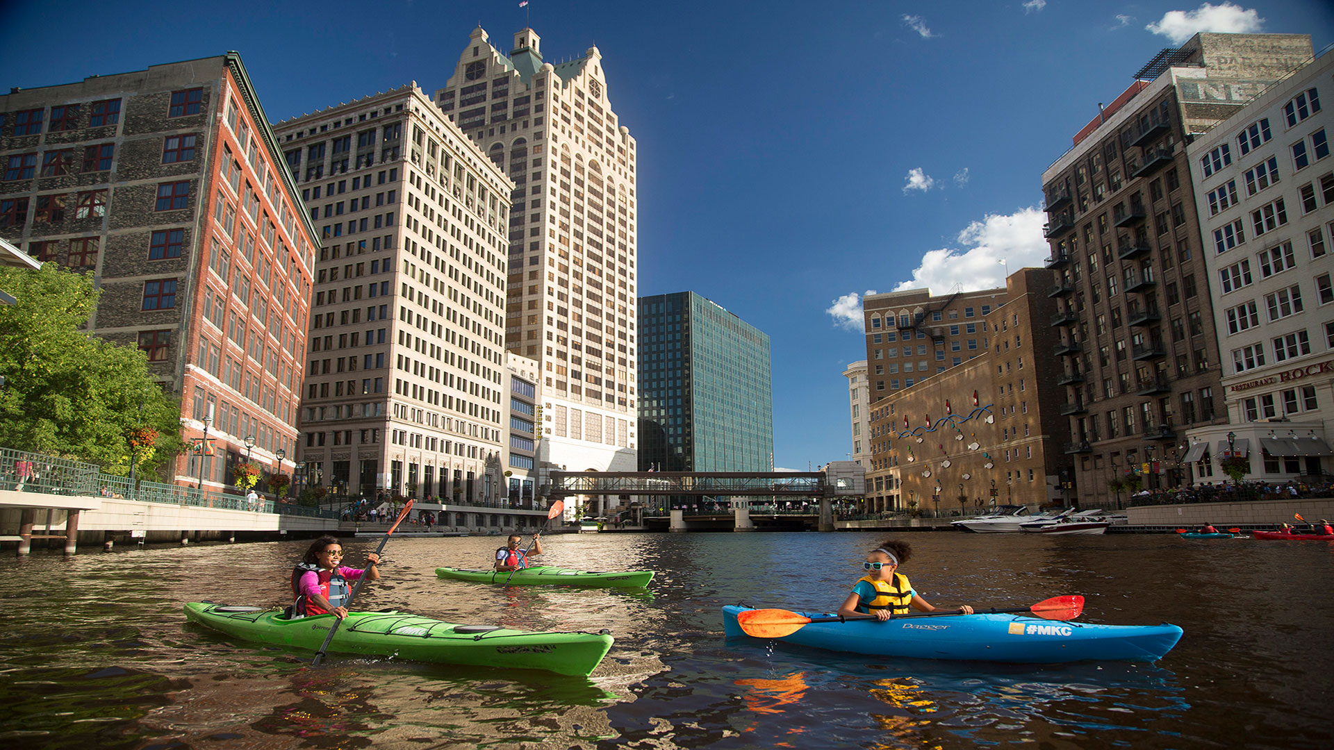 Kayakers on the Milwaukee River in downtown Milwaukee, Wisconsin; Credit: Visit Milwaukee
