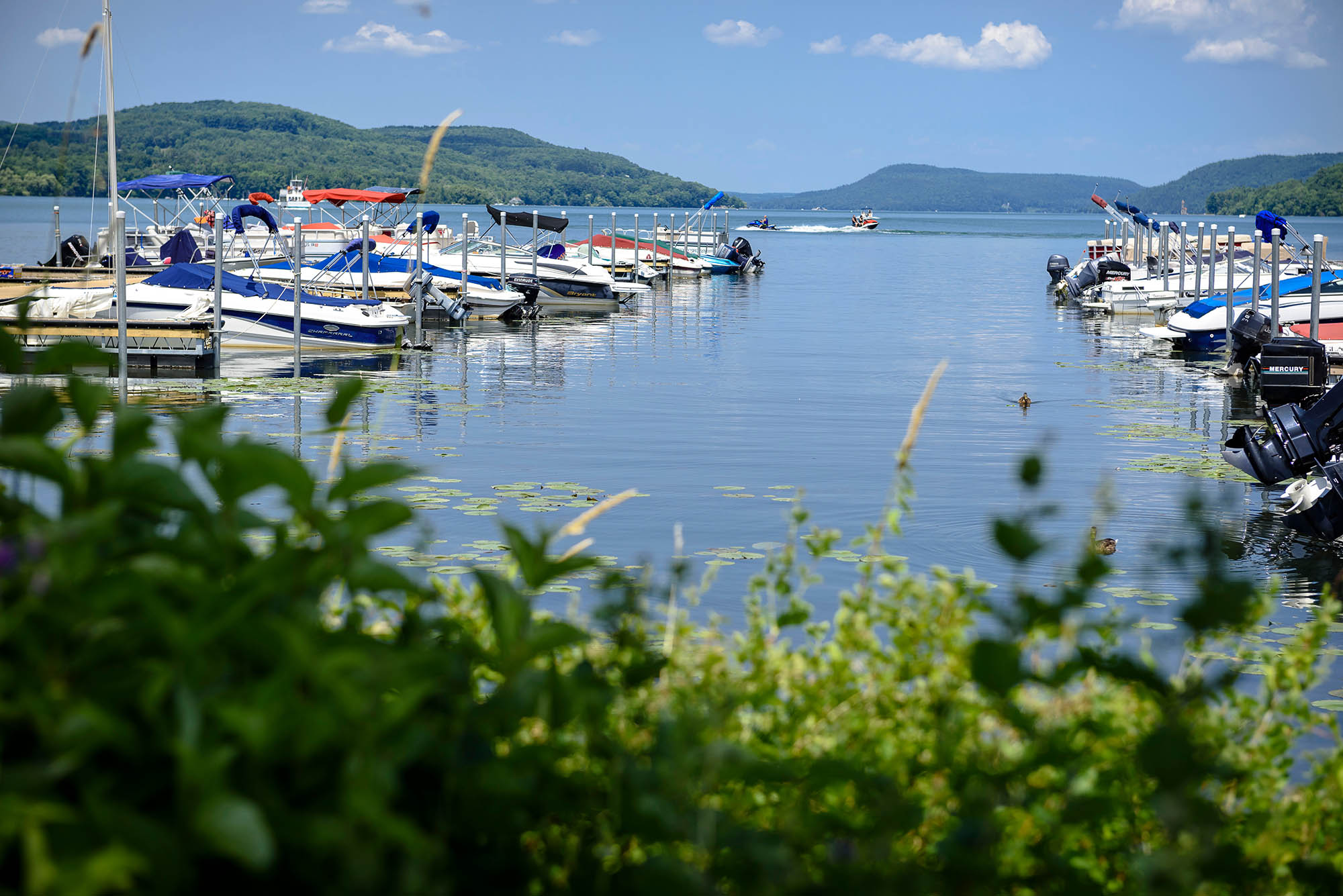 Boats docked at a marina in Cooperstown, New York; Credit: Mitch Wojnarowicz