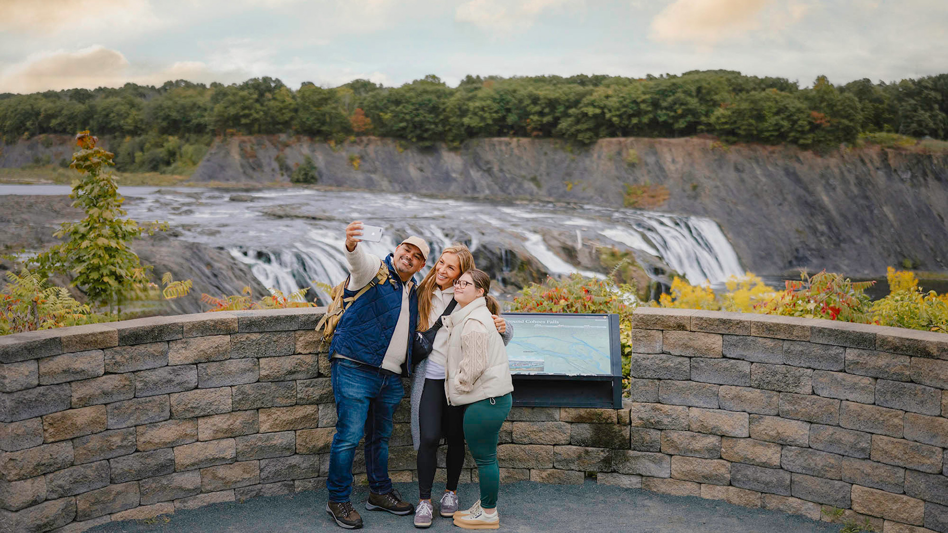 A family poses at Cohoes Falls outside Albany, New York