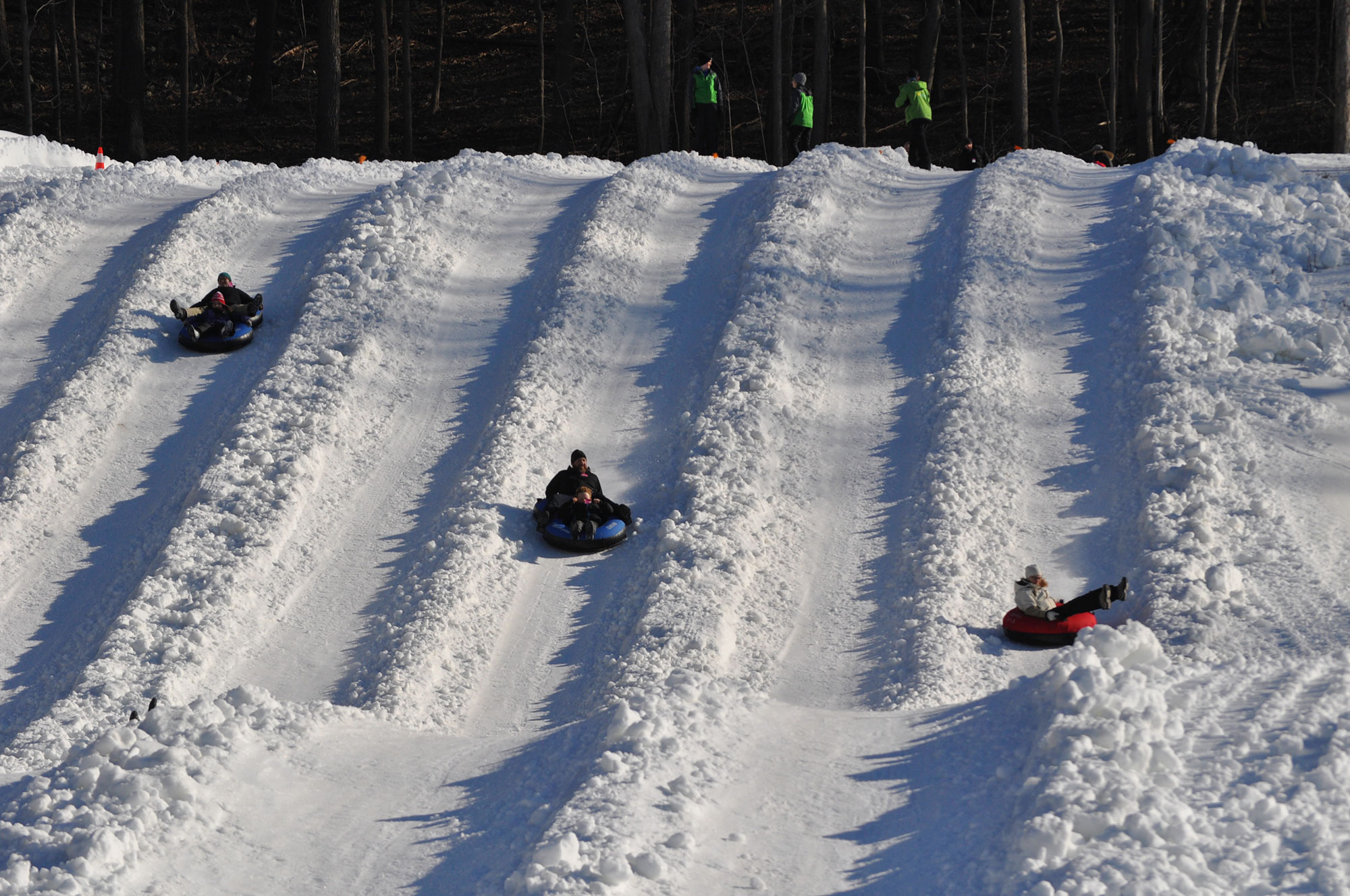 Kids tubing down a snowy hill in Orange County, New York 