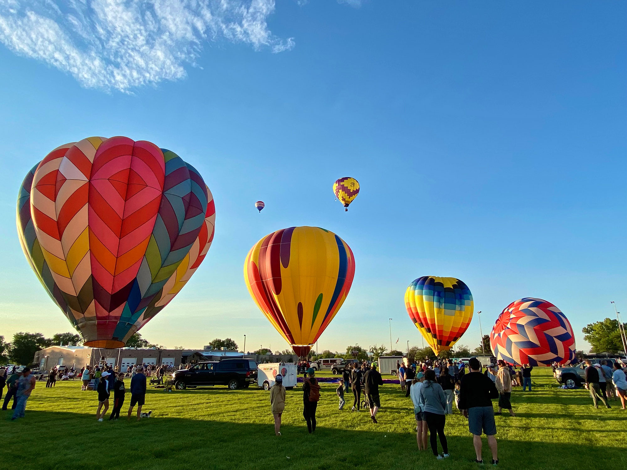 Hot-air balloons and attendees at the Riverton Rendezvous Balloon Rally in Riverton, Wyoming; Credit: Melanie Hoefle/Wind River Country