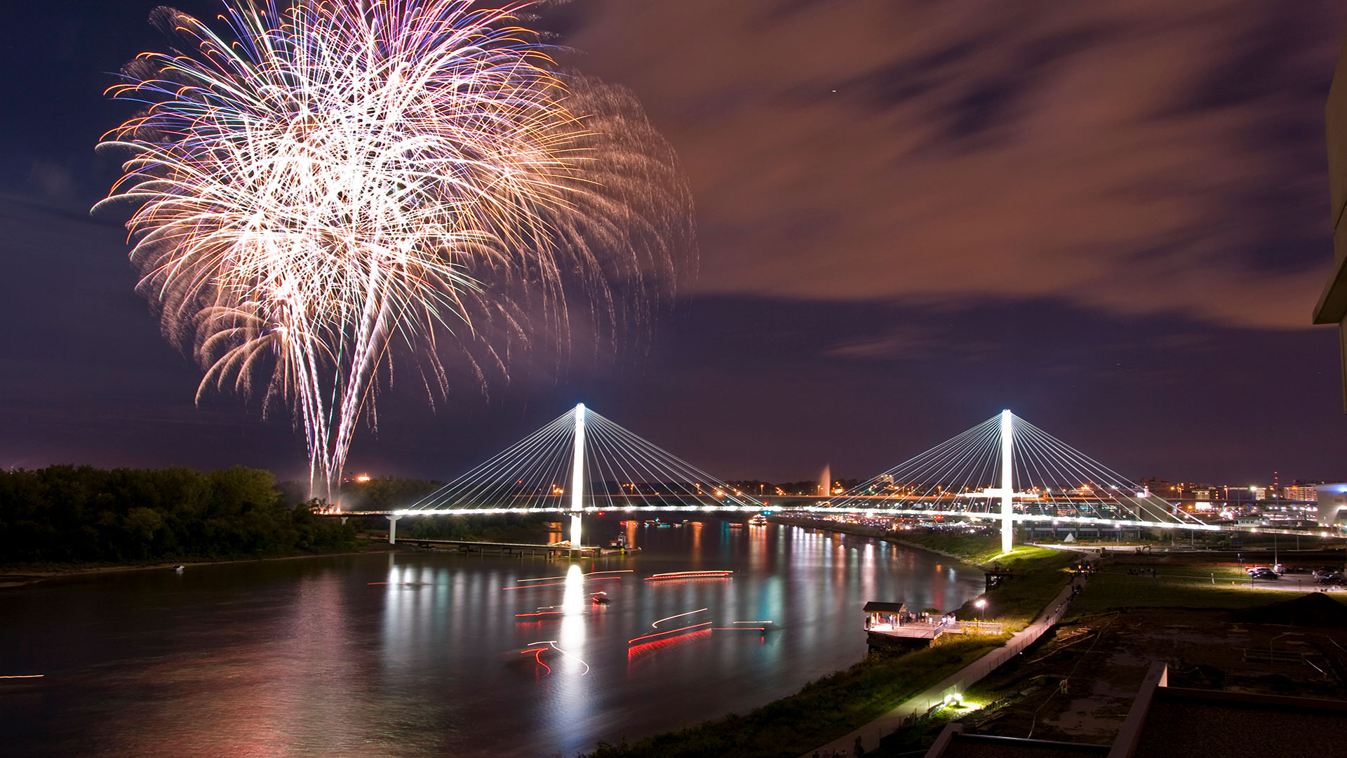 Fireworks illuminating the Bob Kerrey Pedestrian Bridge across the Missouri River in Omaha, Nebraska