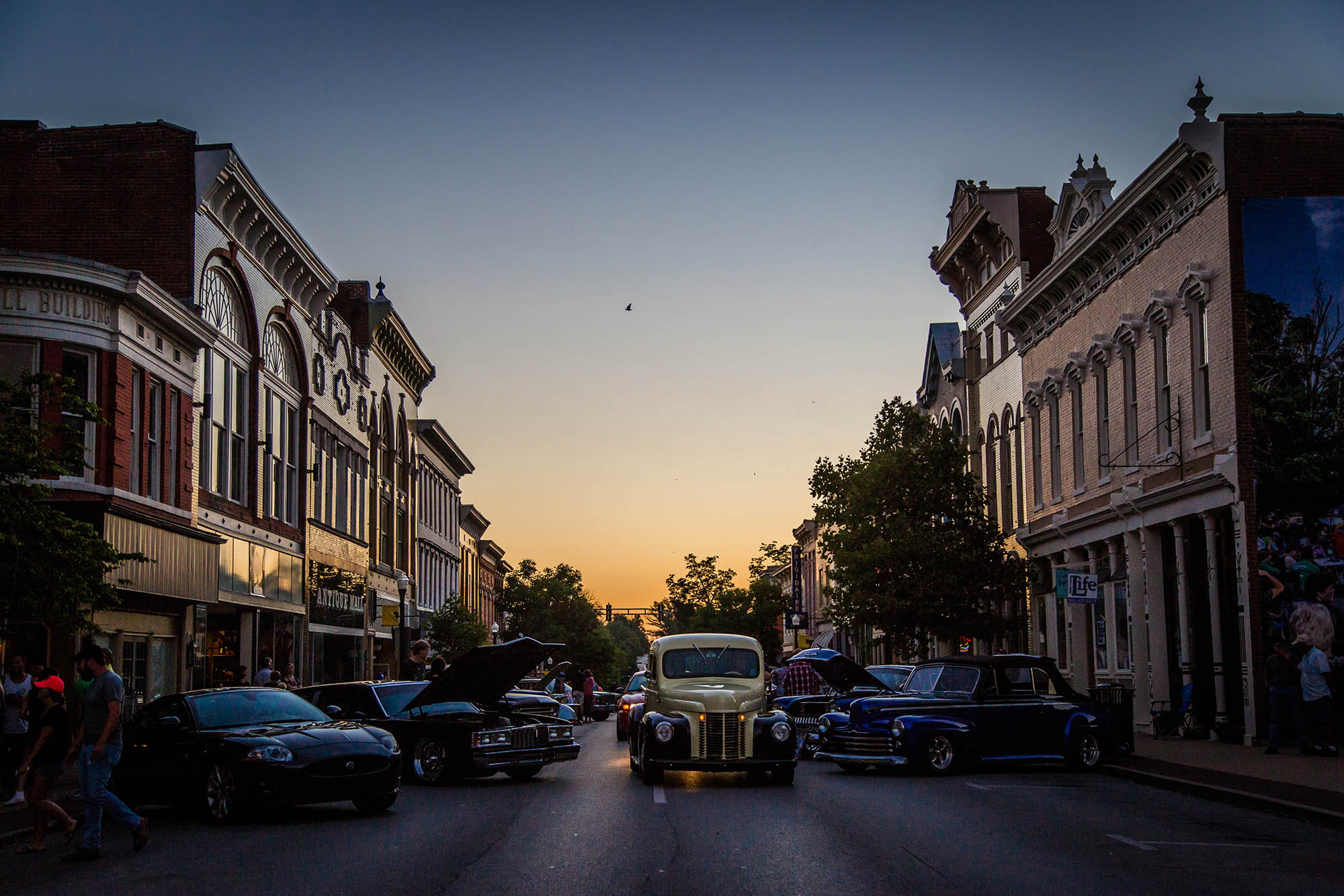 Vintage cars on Main Street during sunset in Shelbyville, Kentucky