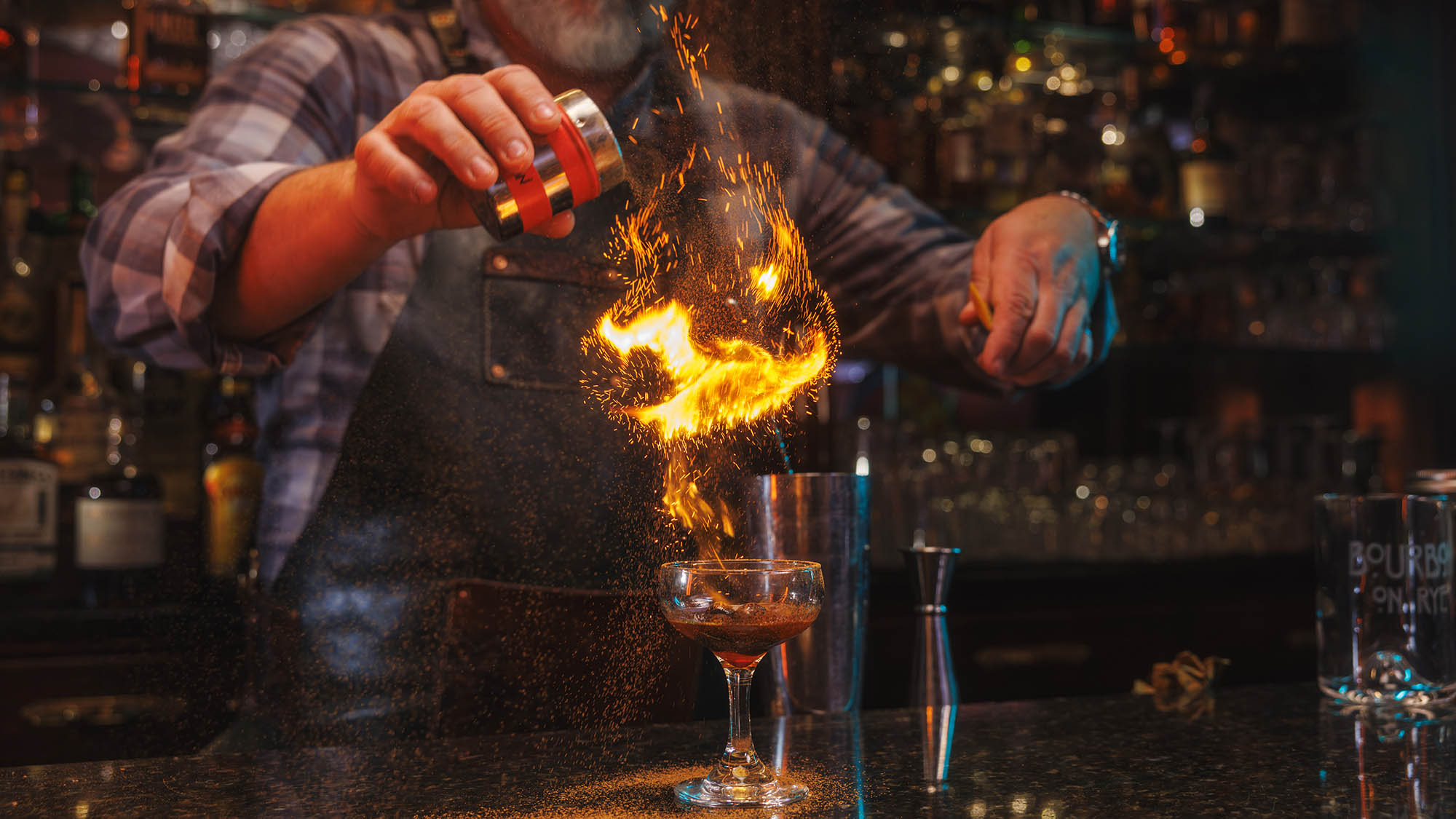 Flaming technique for a bourbon cocktail in Lexington, Kentucky;  
Credit: Richie Wireman
