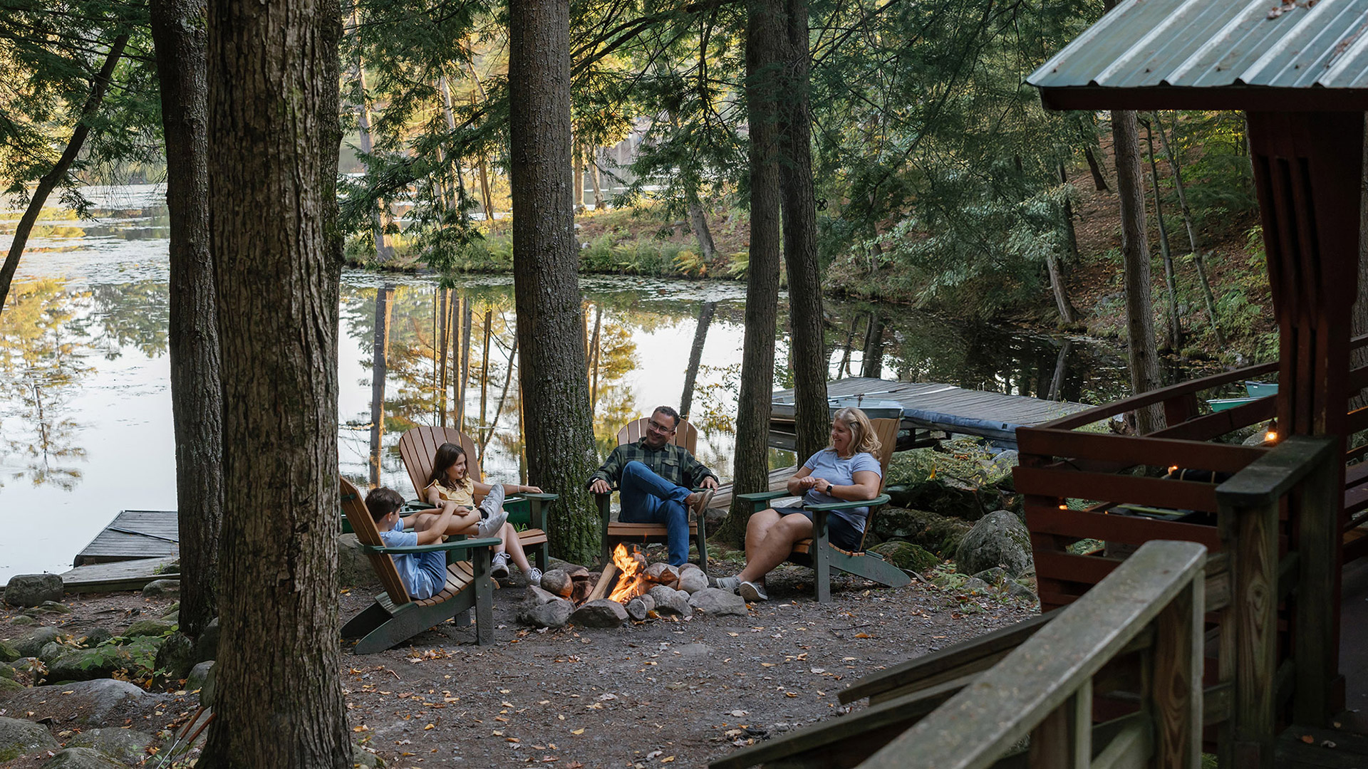 Family enjoying a Hide-A-Way Waterfront Cottage in Lake Luzerne, New York
