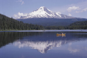 Kayakers paddling on Trillium Lake with Mt. Hood reflected in the water in Oregon’s Mt. Hood Territory; Credit: hood-gorge.com