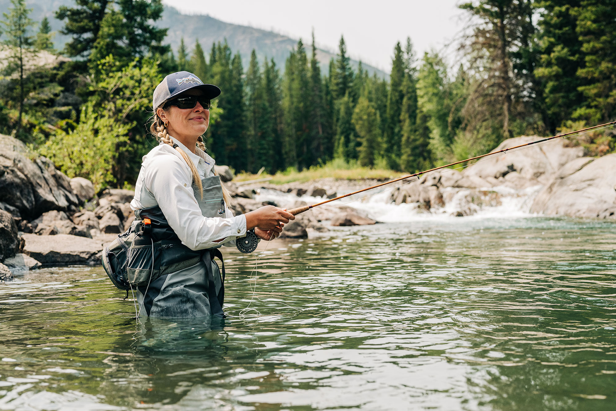 Angler fly-fishing a river in the Shoshone National Forest in Wyoming’s Park County
