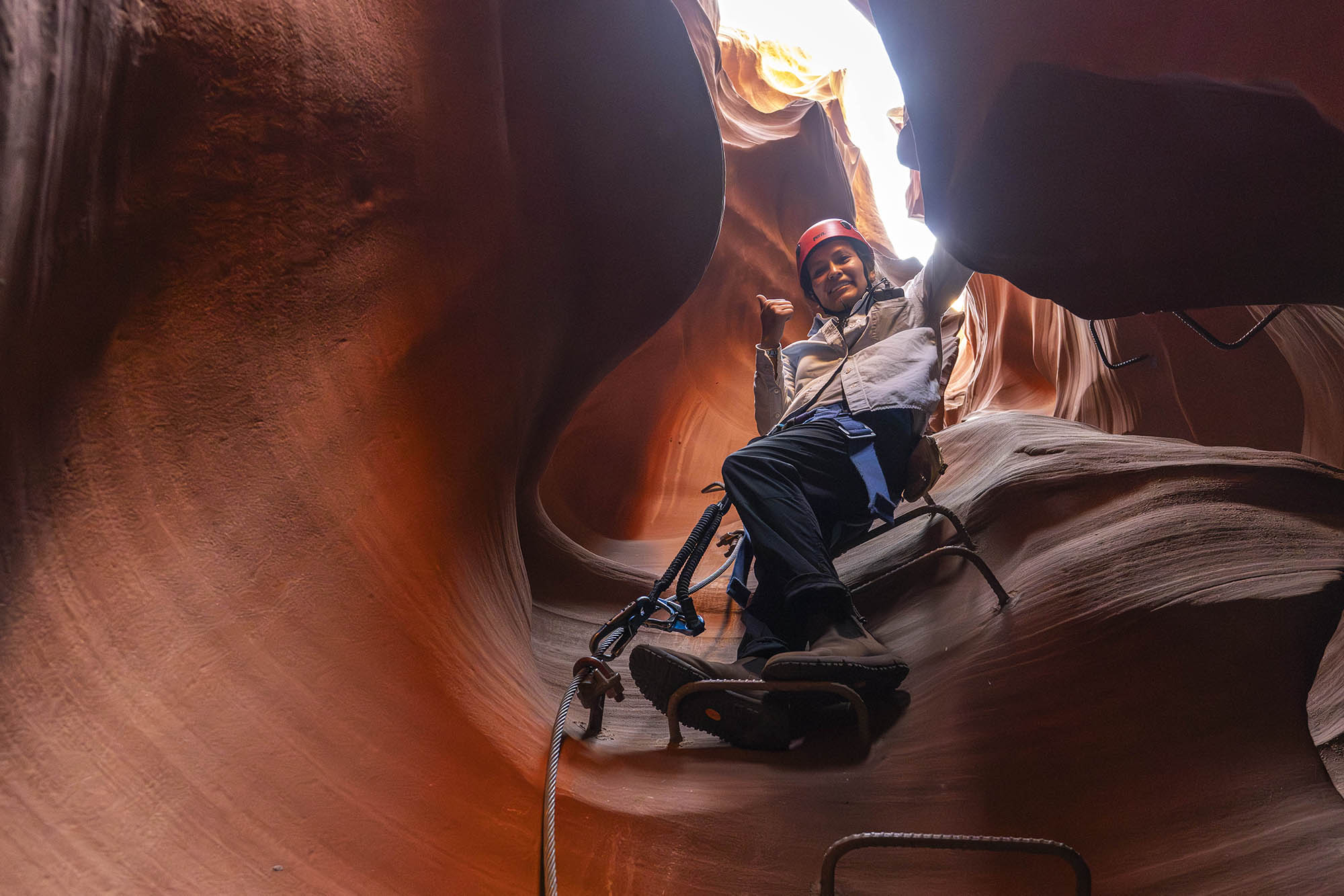 Climbing a slot canyon at Antelope Ridge Adventure Park near Page, Arizona; Credit: Krystal M. Anderson-Begay